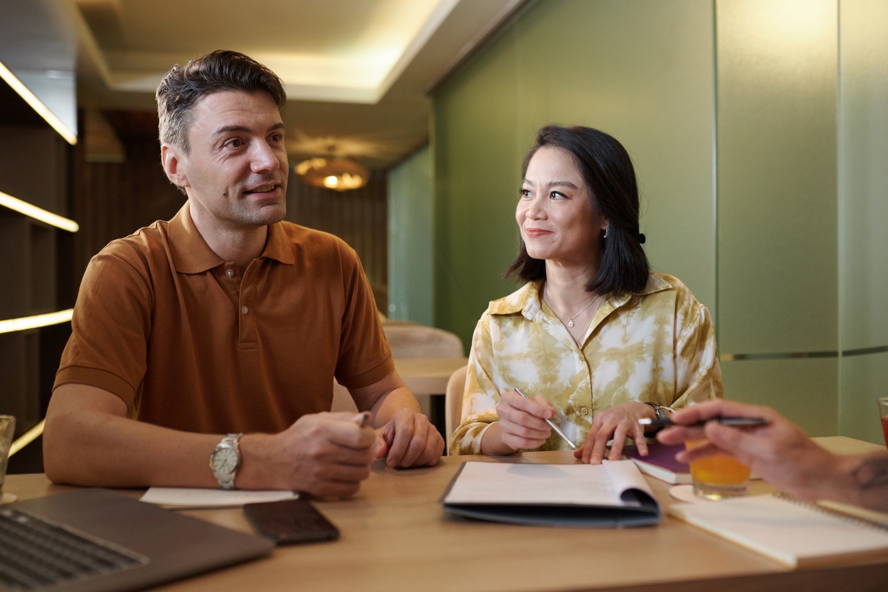 Two professionals reviewing financial information for an opportunity